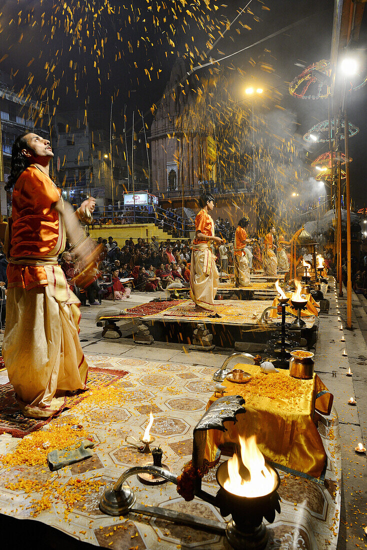 India, Uttar Pradesh, Varanasi, Offering of flowers to the Ganges.
