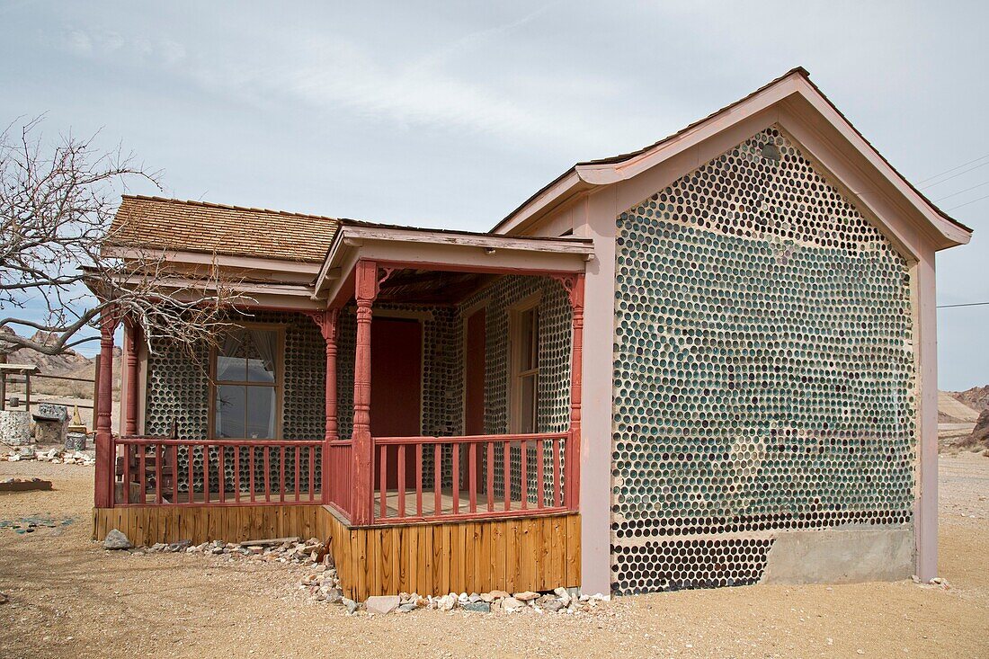 Beatty, Nevada - The bottle house in Rhyolite, a town that boomed for a few years after gold was discovered in 1904. Tom Kelly built the house in 1906 from thousands of discarded beer and liquor bottles. It was repaired in 1925 and 2005.