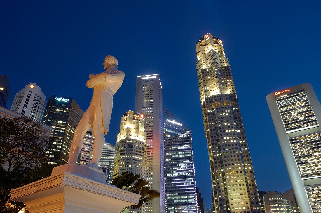 Statue of Sir Stamford Raffles with CBD skyscrapers at the background, Singapore.