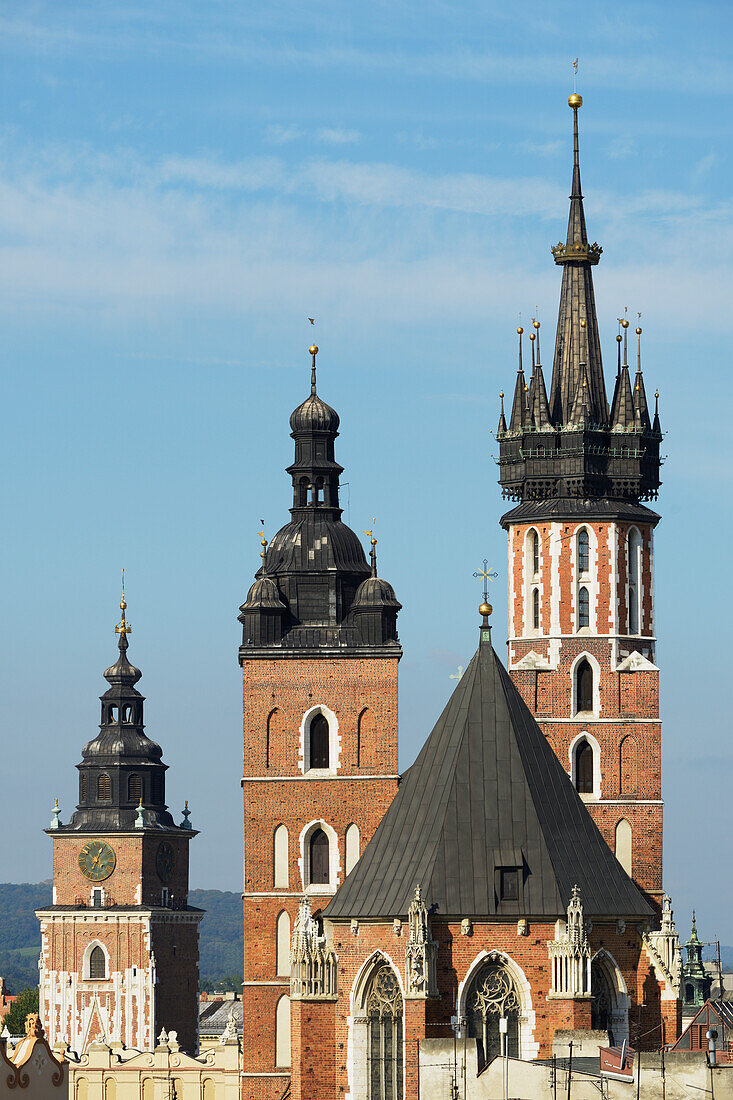 'Town Hall Tower, then the twin towers of St. Mary's Basilica, Old Town Square; Krakow, Poland'