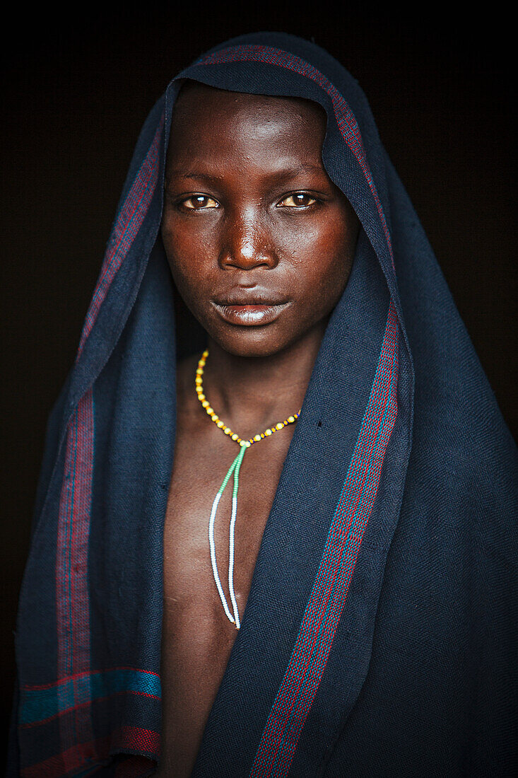 'Young Suri (Surma) boy in a village, Omo region, Southwest Ethiopia; Kibish, Ethiopia'