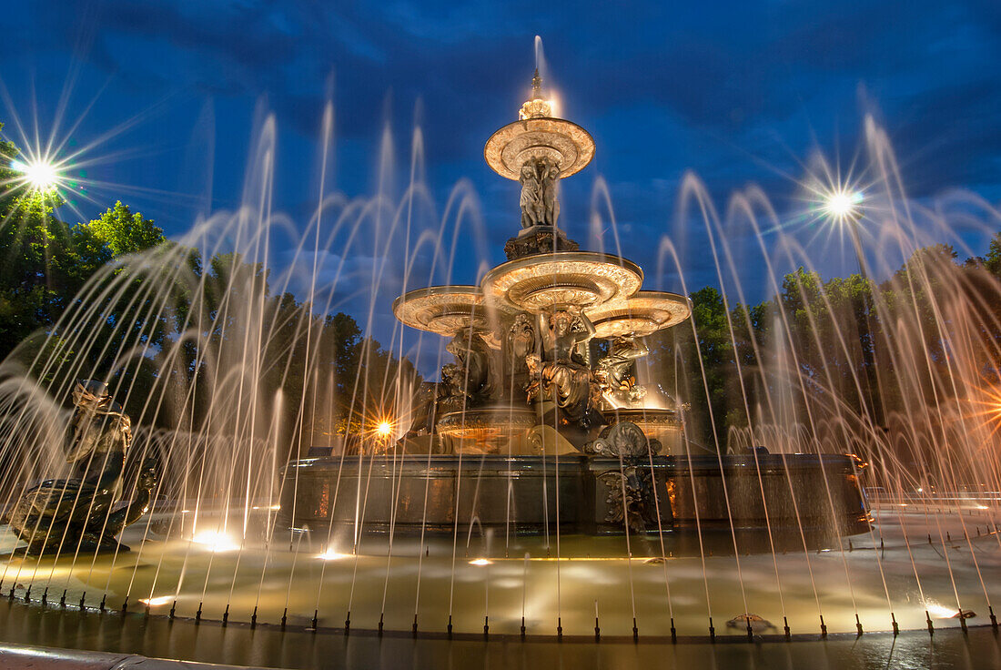 'French-style public water fountain in blue light; Mendoza, Argentina'