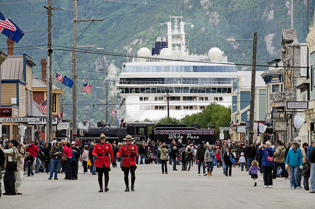 People gather on Broadway awaiting start of July 4th Parade in downtown Skagway, Southeast Alaska