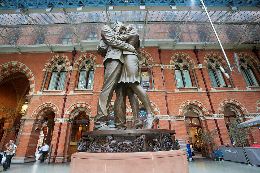 'St. Pancras Railway Station and statue of kissing couple; London, England'
