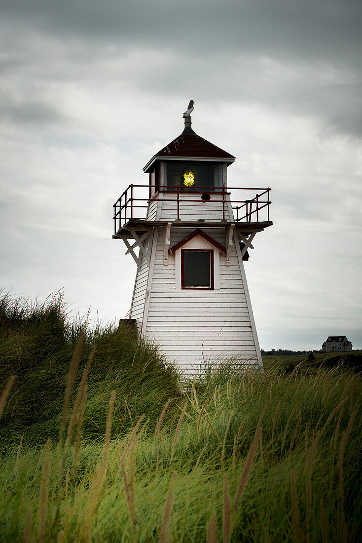 'A red and white lighthouse on the Atlantic coast; Prince Edward Island, Canada'