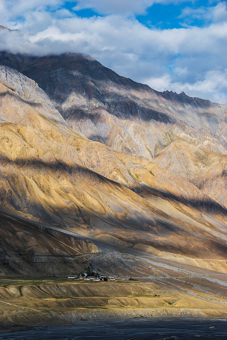 'Clouds cast shadows on the himalayan mountains; Spiti Valley, India'