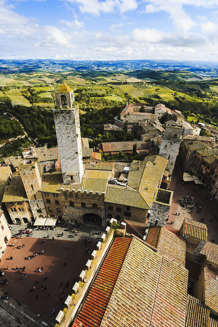 'Stone tower and rooftops; San Gimignano, Tuscany, Italy'