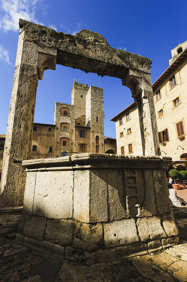 'A historic stone archway; San Gimignano, Tuscany, Italy'
