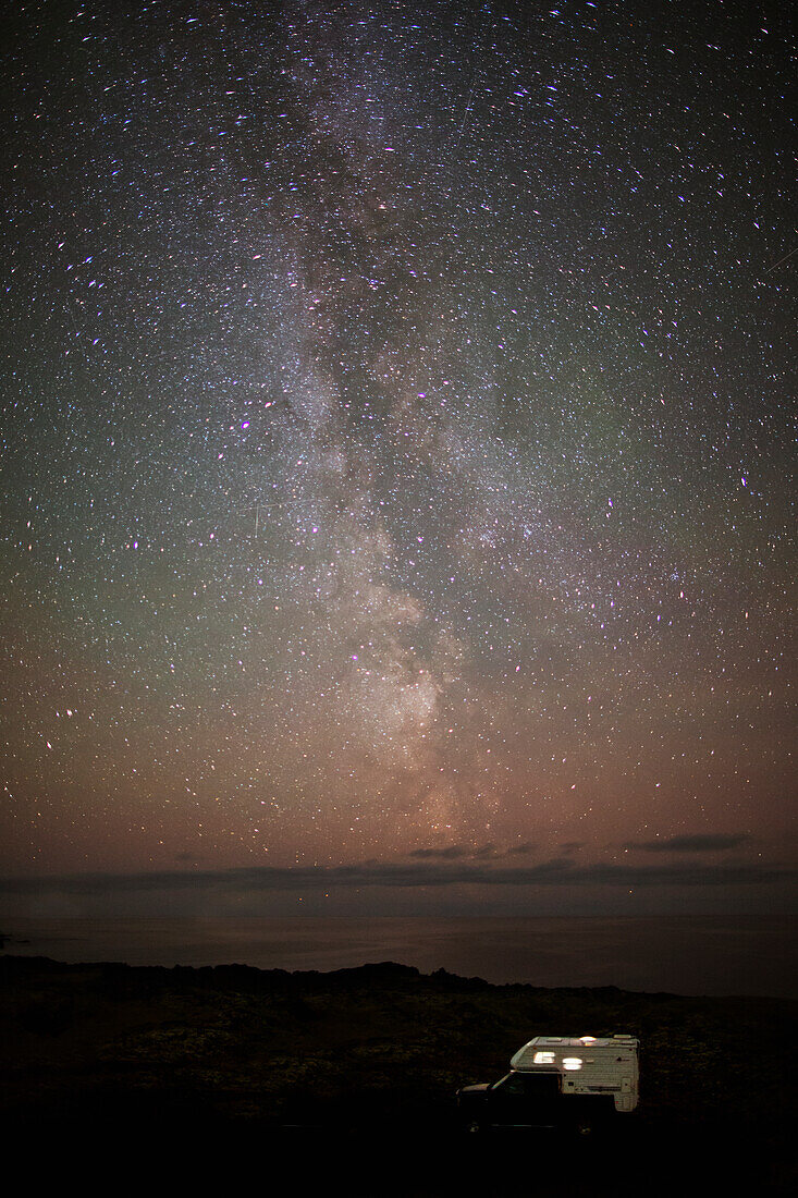 'Camping under the stars (Milky Way Constellation) and with the Atlantic Ocean in the picture, near Budakirkja; Iceland'