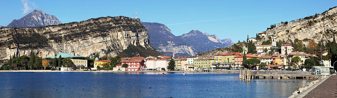 'Cliffs and buildings along the shoreline of Lake Garda; Torbole, Trentino, Italy'