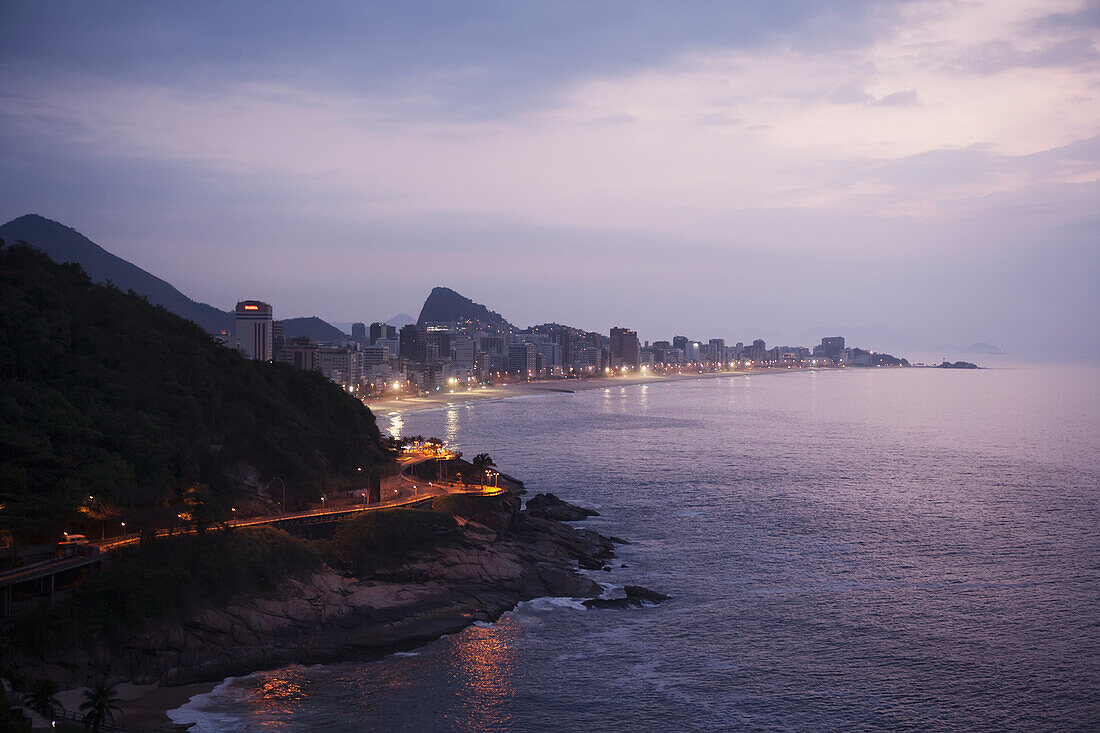 'Lights illuminate the urban coastline; Rio de Janeiro, Brazil'