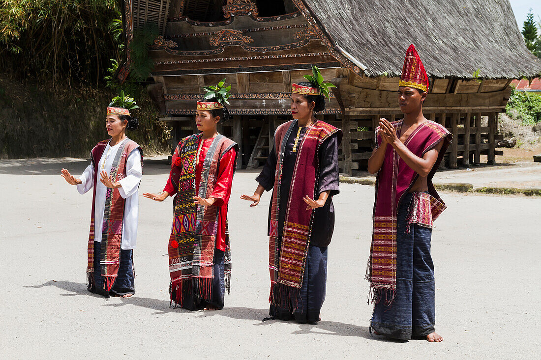 Toba Batak people performing a traditional Batak dance at Huta Bolon Museum in Simanindo village on Samosir Island, Lake Toba, North Sumatra, Indonesia