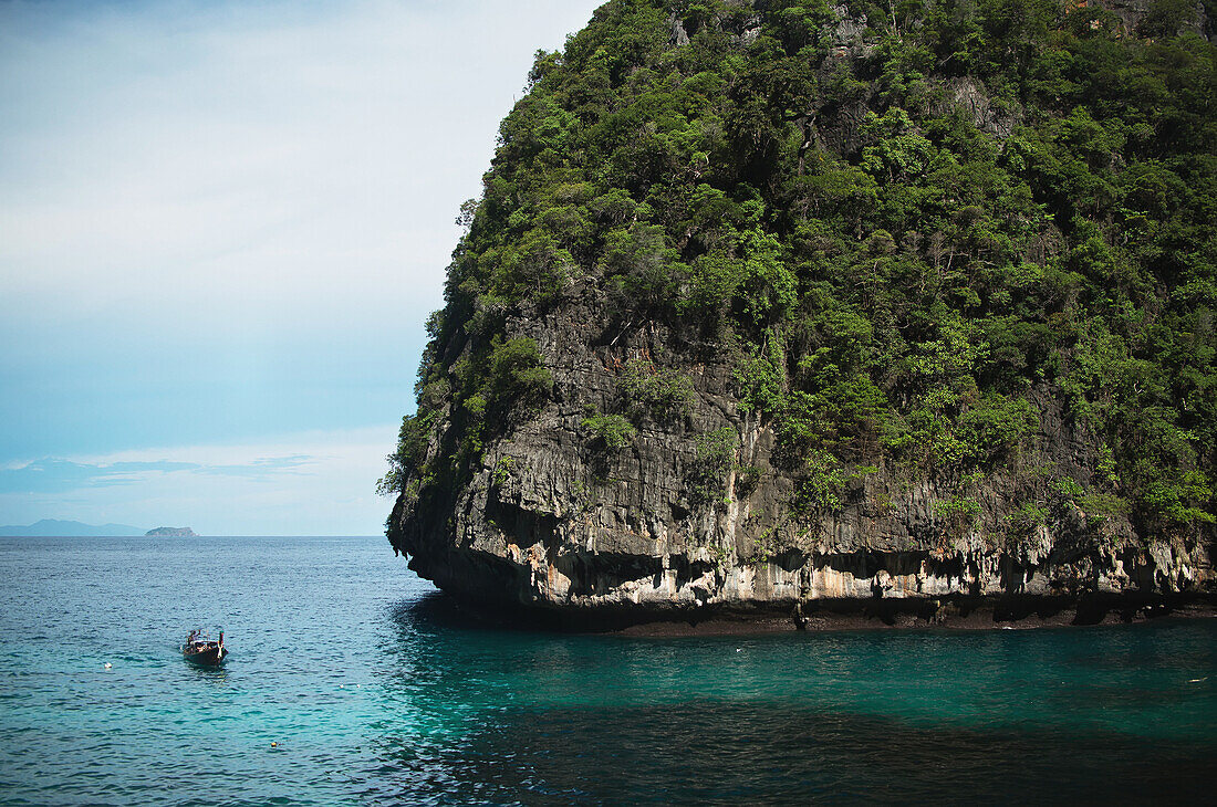 'A boat enters a protected bay on the island of Koh Phi Phi in the Andaman Sea; Thailand'