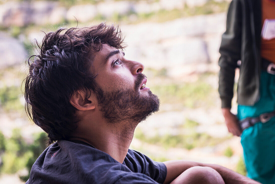 Climber looking at the routes on a summer day, at Margalef.