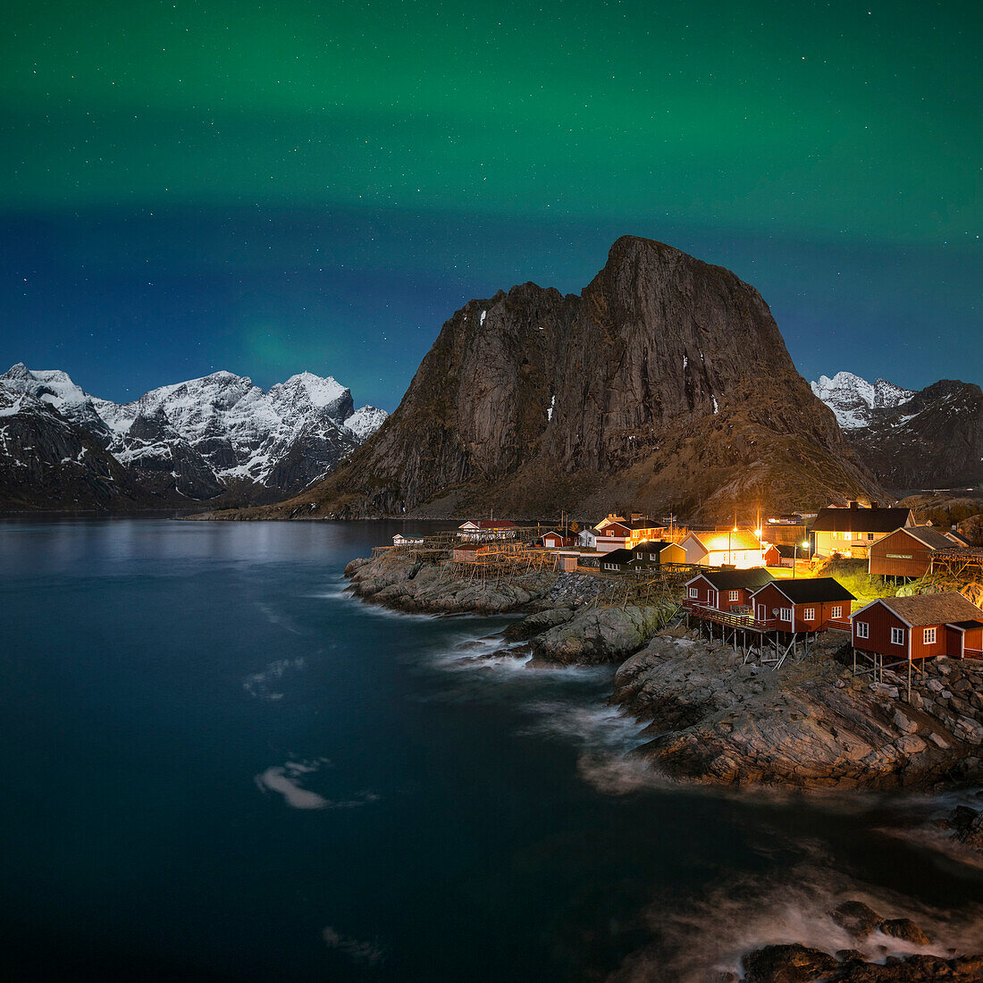 Northern Lights - Aurora Borealis shine in sky over Hamn??y, near Reine, Moskenes??y, Lofoten Islands, Norway