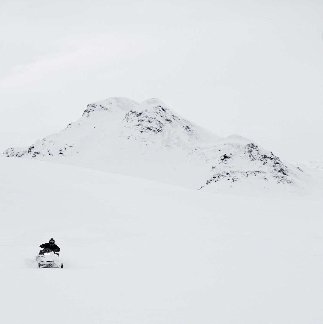 Man riding snowmobil through the Fjallabak area in Iceland