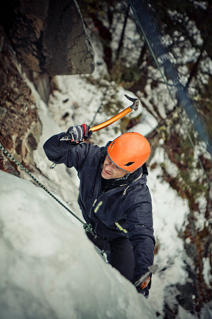 A man ice climbing near Whistler, BC, Canada.