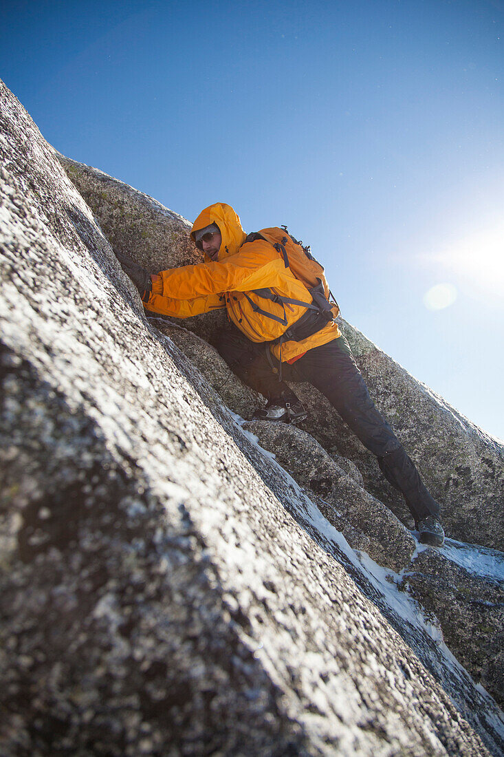 A mountaineer navigates a crux en route Needle Peak in the Coquihalla Recreation Area of British Columbia, Canada.