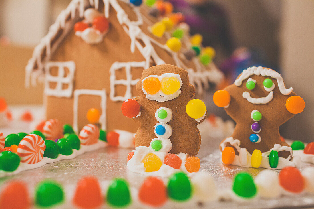 Decorated gingerbread house and people.