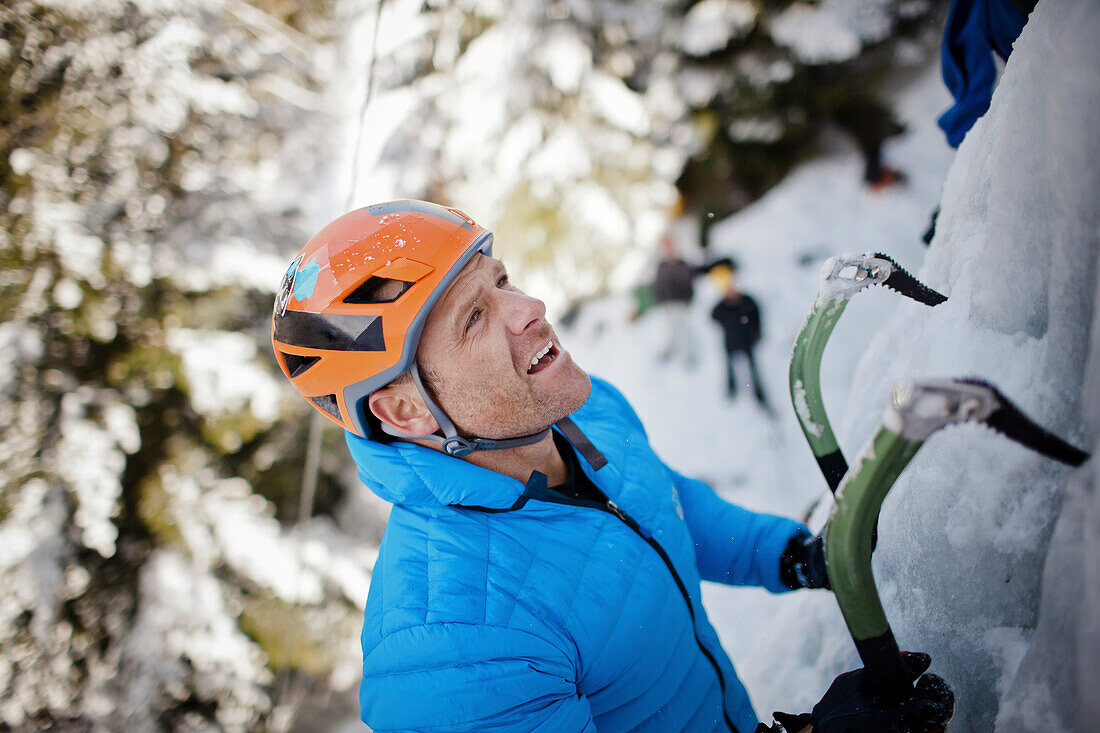 A ice climber looks for his next hold in Whistler, British Columbia, Canada.