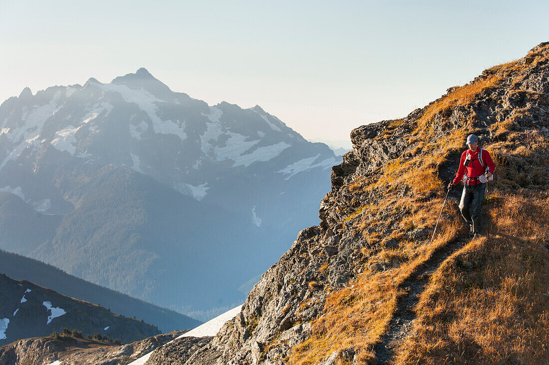 A man backpacking in the North Cascade Mountains.