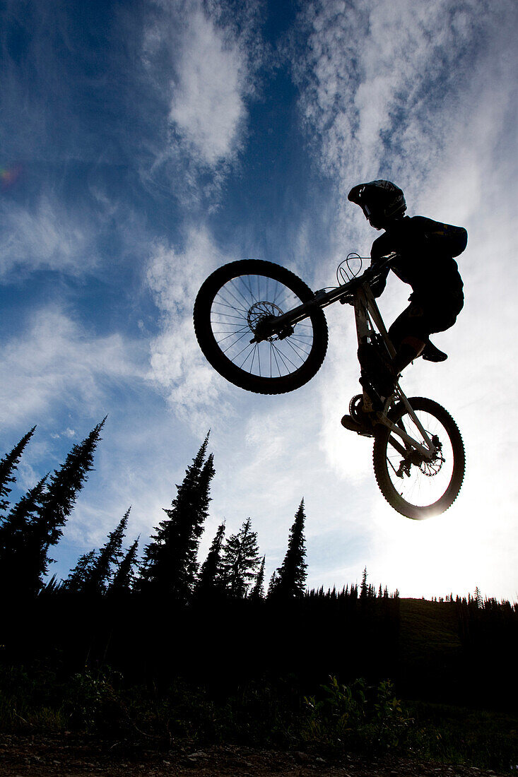 Mountain biker catching air in Whitefish, Montana.