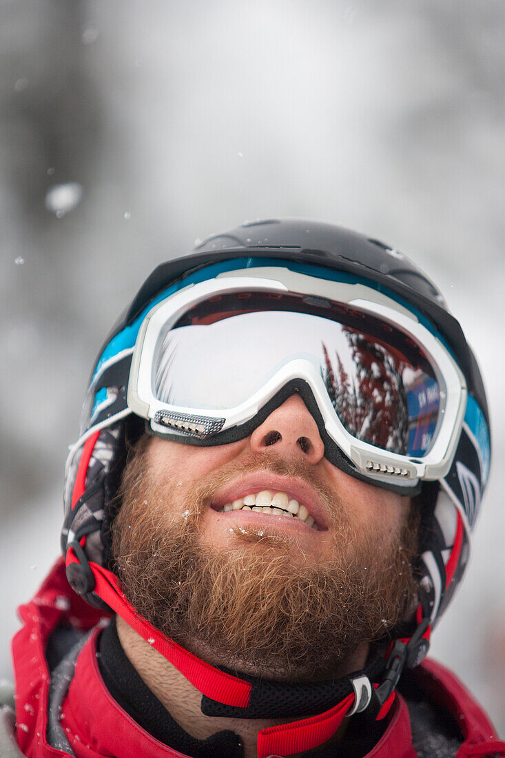 A male skier smiles in Big Sky, Montana.
