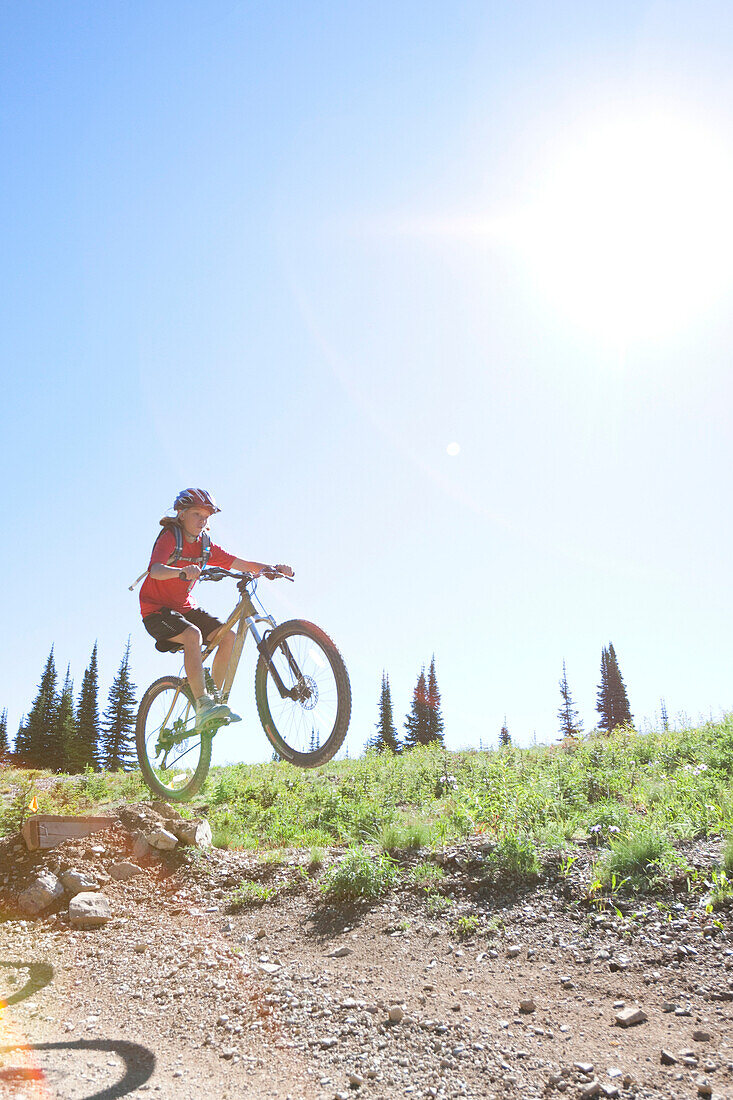 A teenage girl rides her mountain bike in Whitefish, Montana.