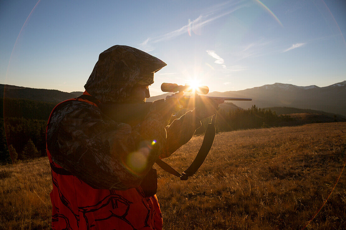 A male hunter at sunrise.