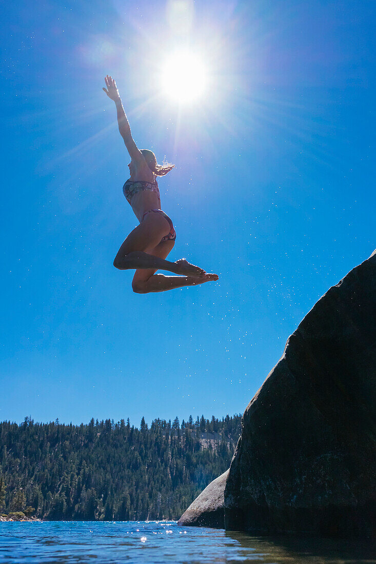Sabina Allemann is jumping into the clear blue water at Emerald Bay, Lake Tahoe.