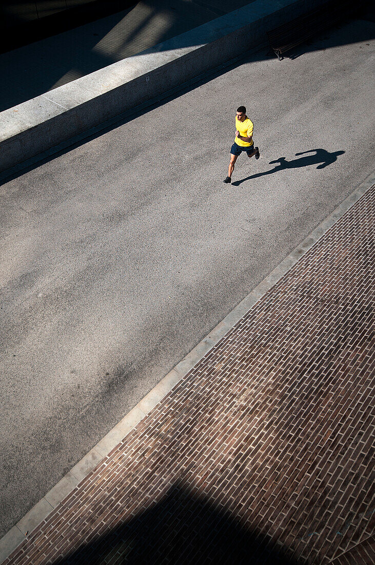 Male running on path in Barcelona, Spain.