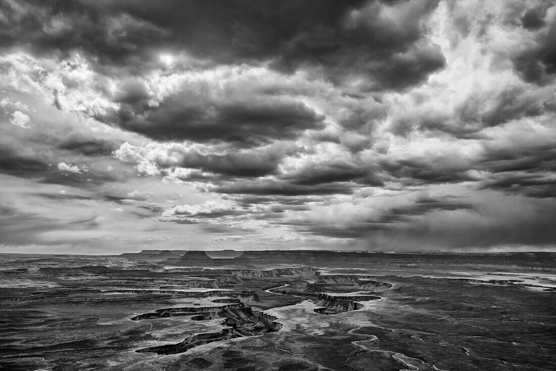 Thunderstorm rolling over the White Rim overlook at Canyonlands National Park, UT in Black and White