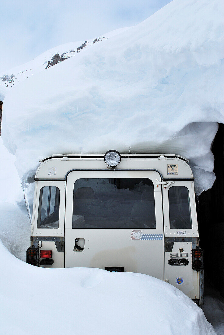 Snow covered classic 4x4 car.