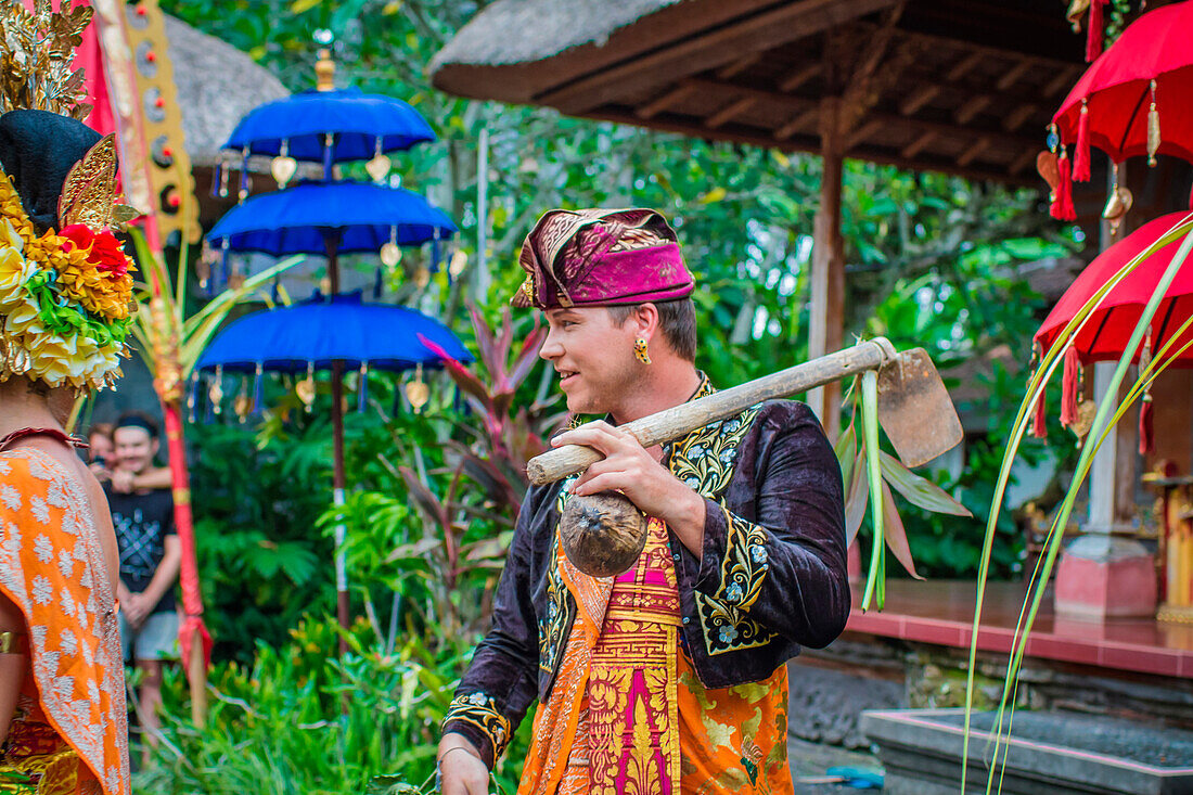 Man enacting wedding scene in preparation for religious ceremony.Bali. Indonesia