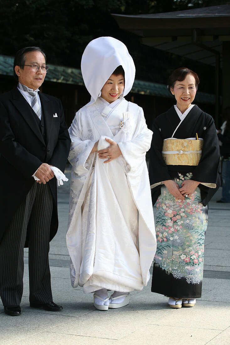 'After The Traditional Japanese Shinto Wedding Ceremony A Formal Portrait Sitting Takes Place, At Meiji Jingu Shrine; Near Harajuku Station; Tokyo. Here The Bride And Close Family Pose For A Photographer In More Informal Shots Compared To The Formal Group