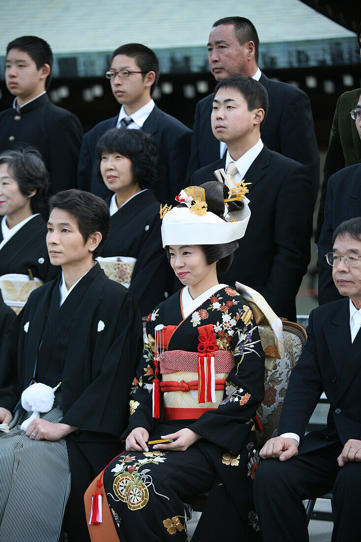 'After The Traditional Japanese Shinto Wedding Ceremony Families Gather For A Formal Portrait Sitting, At Meiji Jingu Shrine; Near Harajuku Station; Tokyo. There Are Several Layers Of The Brides Kimono.The Groom's Ensemble Is Simpler, In A Traditional Shi