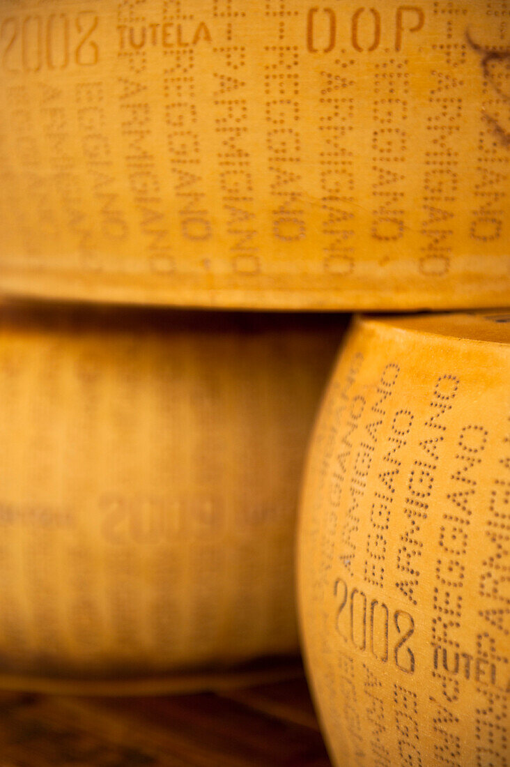 Whole parmesan cheeses for sale in Kaaskamer cheese shop, Amsterdam, Holland.