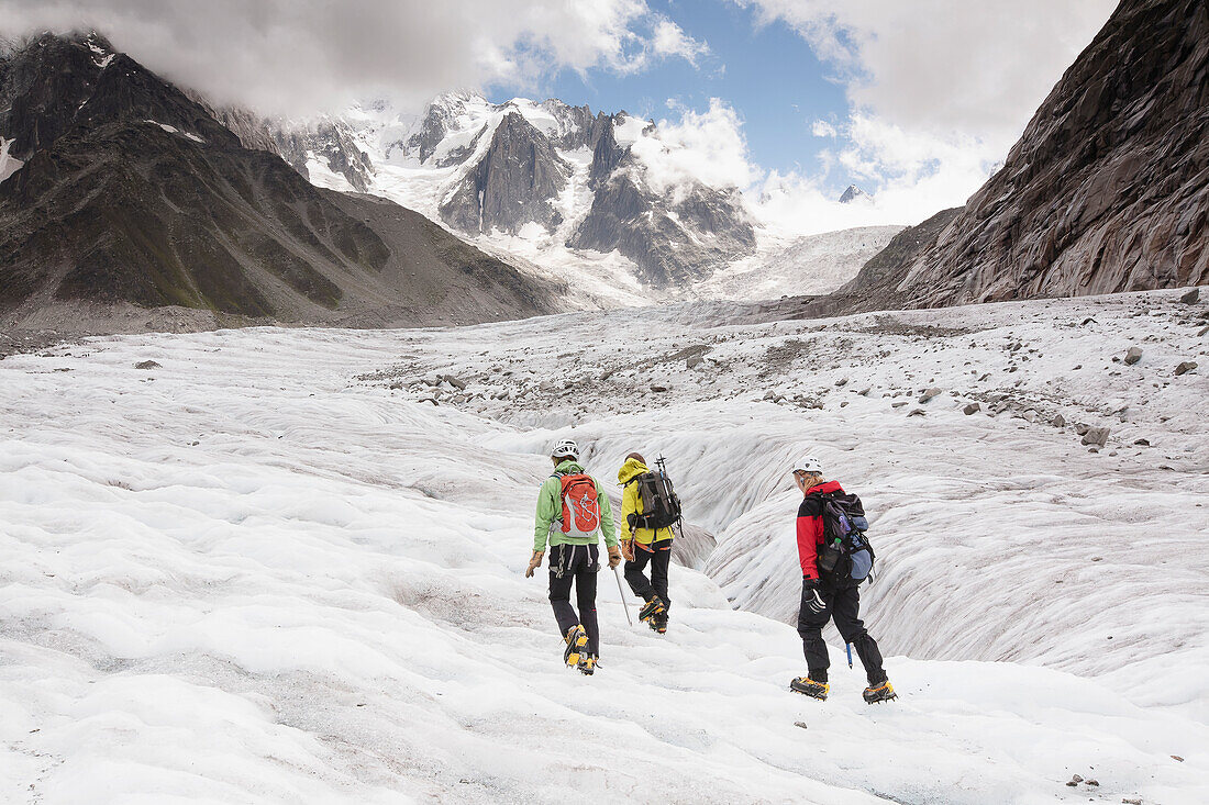 'A guide on Mer de Glace (Sea of Ice) glacier teaching crampon and ice-axe techniques prior to attempt on climbing Mont Blanc; France'