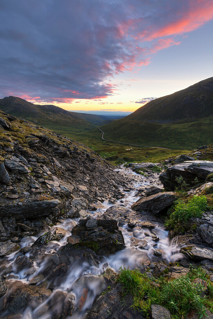 Scenic sunset view of a mountain stream at Summit Lake State Recreation Site, Hatcher Pass, Southcentral Alaska, Summer