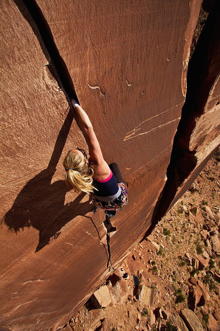 'A rock climber on Blue Sun 5.0; Indian Creek, Utah, United States of America'