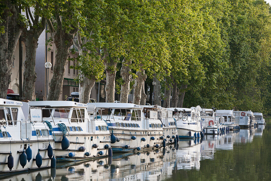 'Boats moored along the shoreline of the Canal du Midi; France'