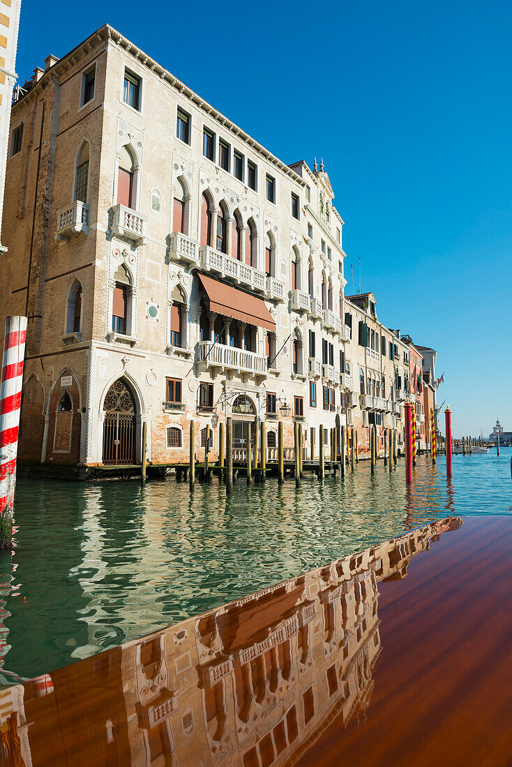 'Buildings along the shoreline of the Grand Canal viewed from a boat; Venice, Veneto, Italy'