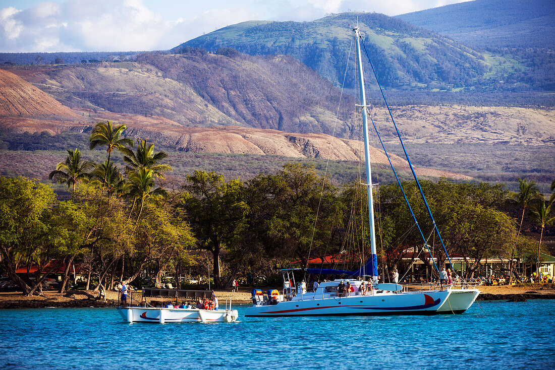 'Vistors leave sailing vessel Seasmoke after a cruise; Anaeho'omalu Bay, Island of Hawaii, Hawaii, United States of America'