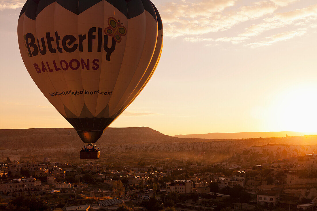 'A hot air balloon in flight at sunset; Cappadocia, Turkey'