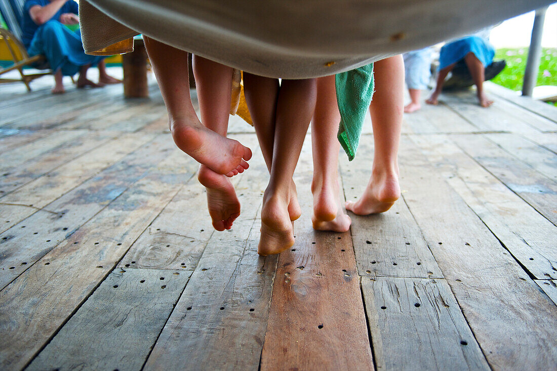 'Bare feet hanging from a hammock; Ulpotha, Embogama, Sri Lanka'