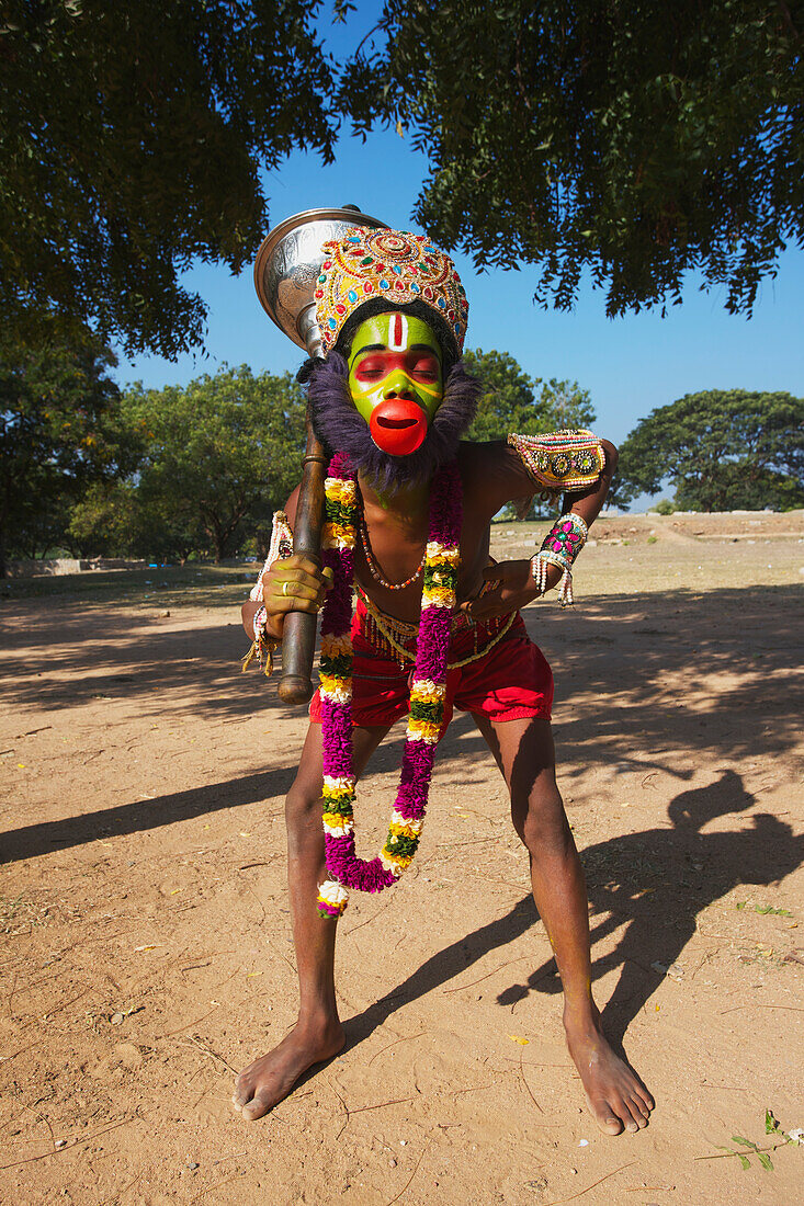 'Vijayanagara ruins, boy dressed as a Hunuman monkey god; Hampi, Karnataka, India'