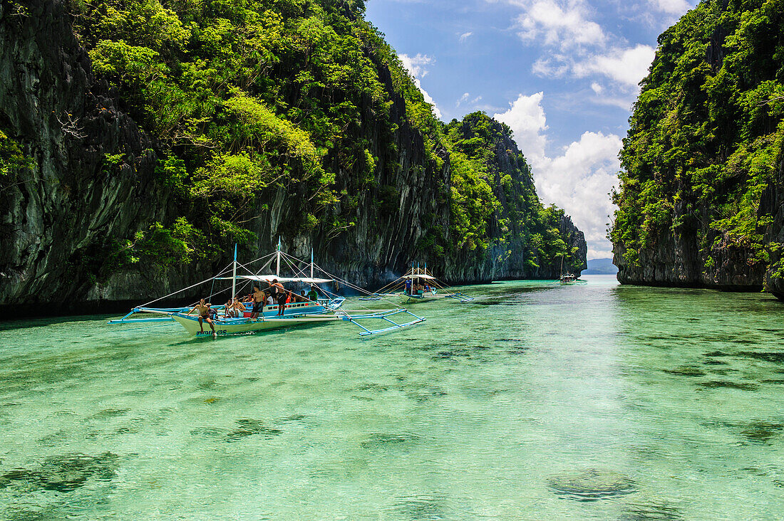 Outrigger boats in the crystal clear water in the Bacuit archipelago, Palawan, Philippines, Southeast Asia, Asia