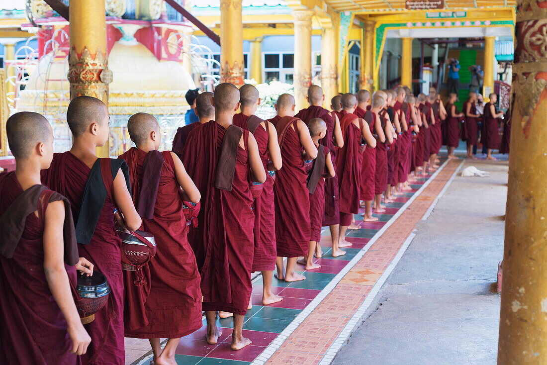 Meal time at the Kha Khat Wain Kyaung monastery, Bago, Myanmar (Burma), Asia