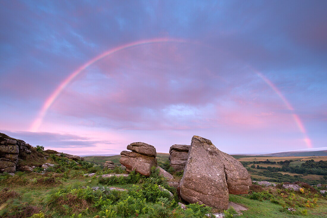 Rainbow over Holwell Tor at sunrise, Dartmoor, Devon, England, United Kingdom, Europe