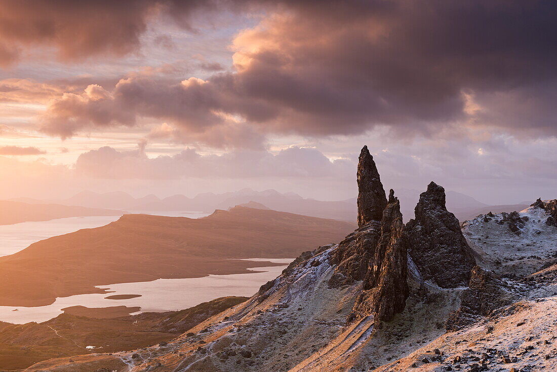 Beautiful sunrise over a snow dusted Old Man of Storr, Isle of Skye, Inner Hebrides, Scotland, United Kingdom, Europe